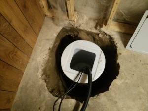 rather than repair the sump pump, we installed a new on - edmonton sump pump installation - sump in basement hole 