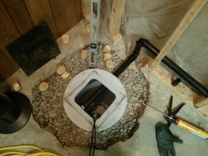 edmonton sump pump installation - gravel surrounds sump pump in hole